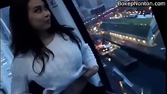 Stunning Young Asian Woman Reveals Her Ample Bosom In A Public Setting.