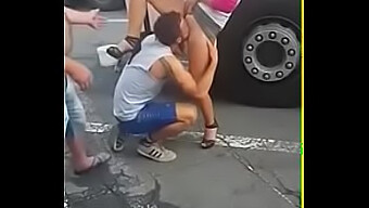 A Man Gives Oral Pleasure To A Woman'S Genitals In A Public Setting