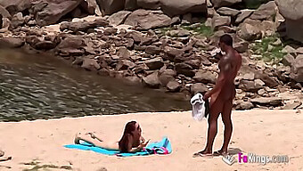 Black Man With A Large Penis Attracts Attention On A Nudist Beach